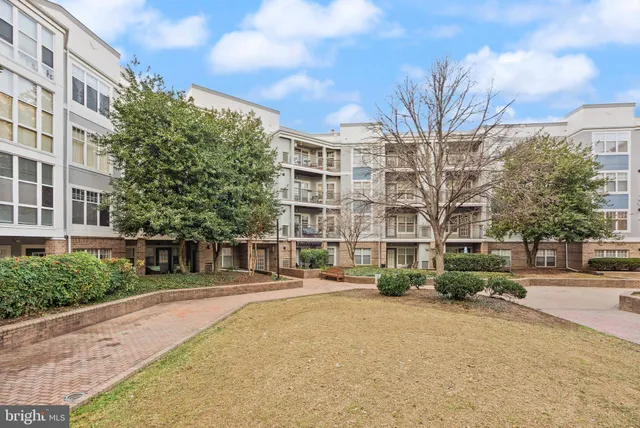 a city street lined with buildings and trees