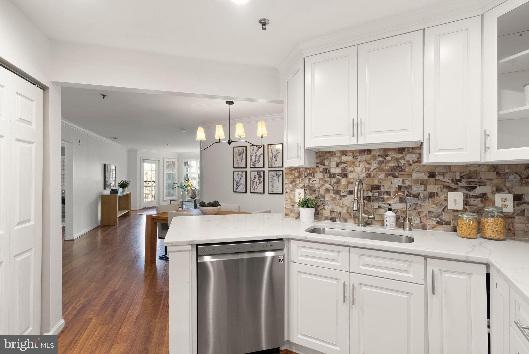 5565 Seminary Road, Unit 209 Falls Church, VA 22041 - Photo 8 of 34 a kitchen with a sink stove and cabinets