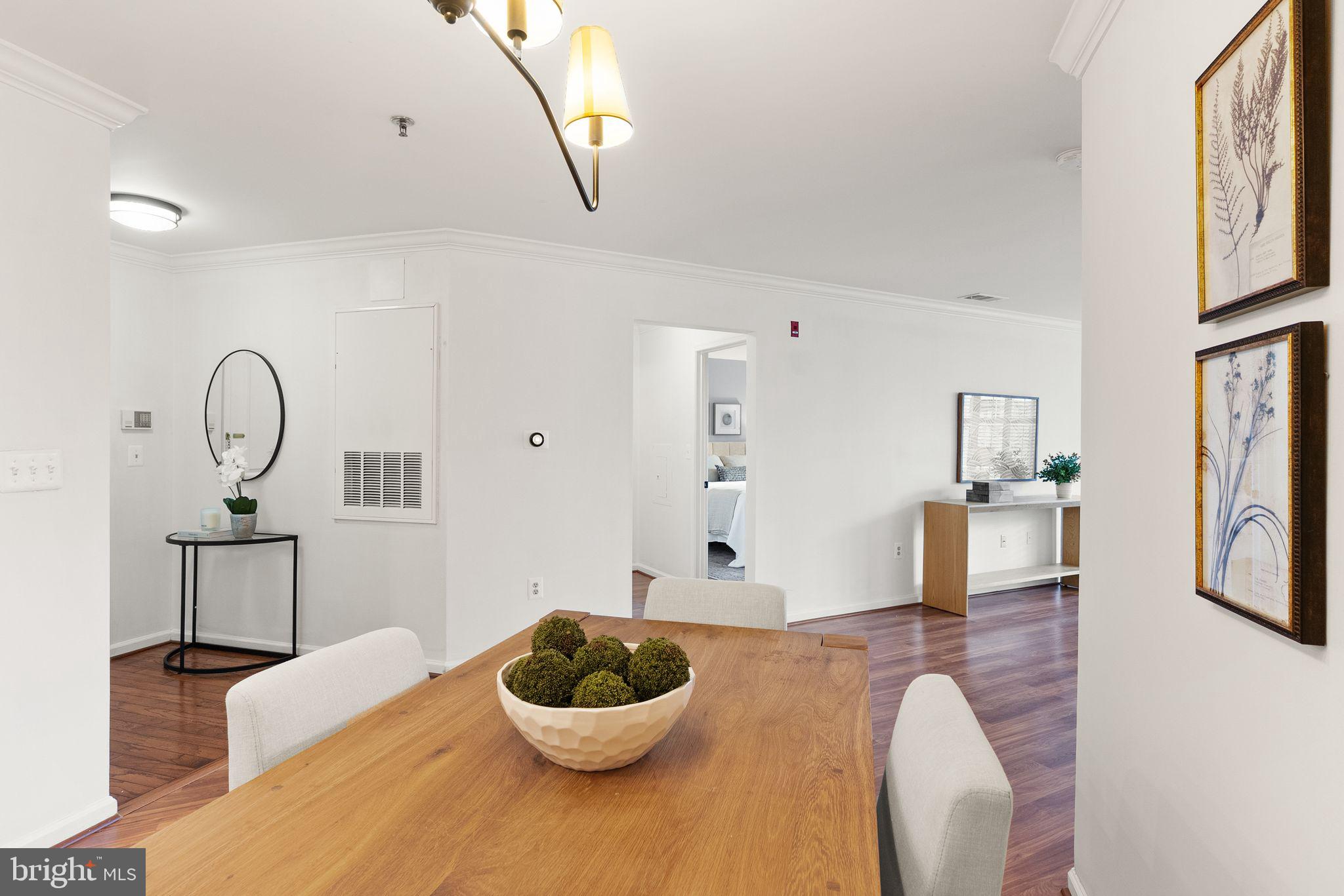 5565 Seminary Road, Unit 209 Falls Church, VA 22041 - Photo 9 of 34 a living room with furniture and a wooden floor