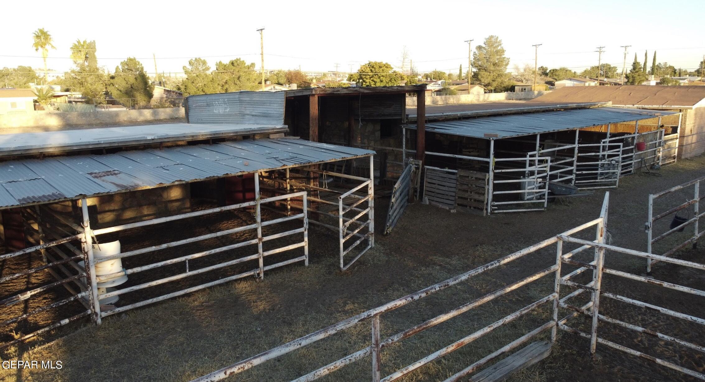 875 Le Barron Road El Paso, TX 79907 - Photo 10 of 15 a view of a balcony with two chairs and a wooden fence