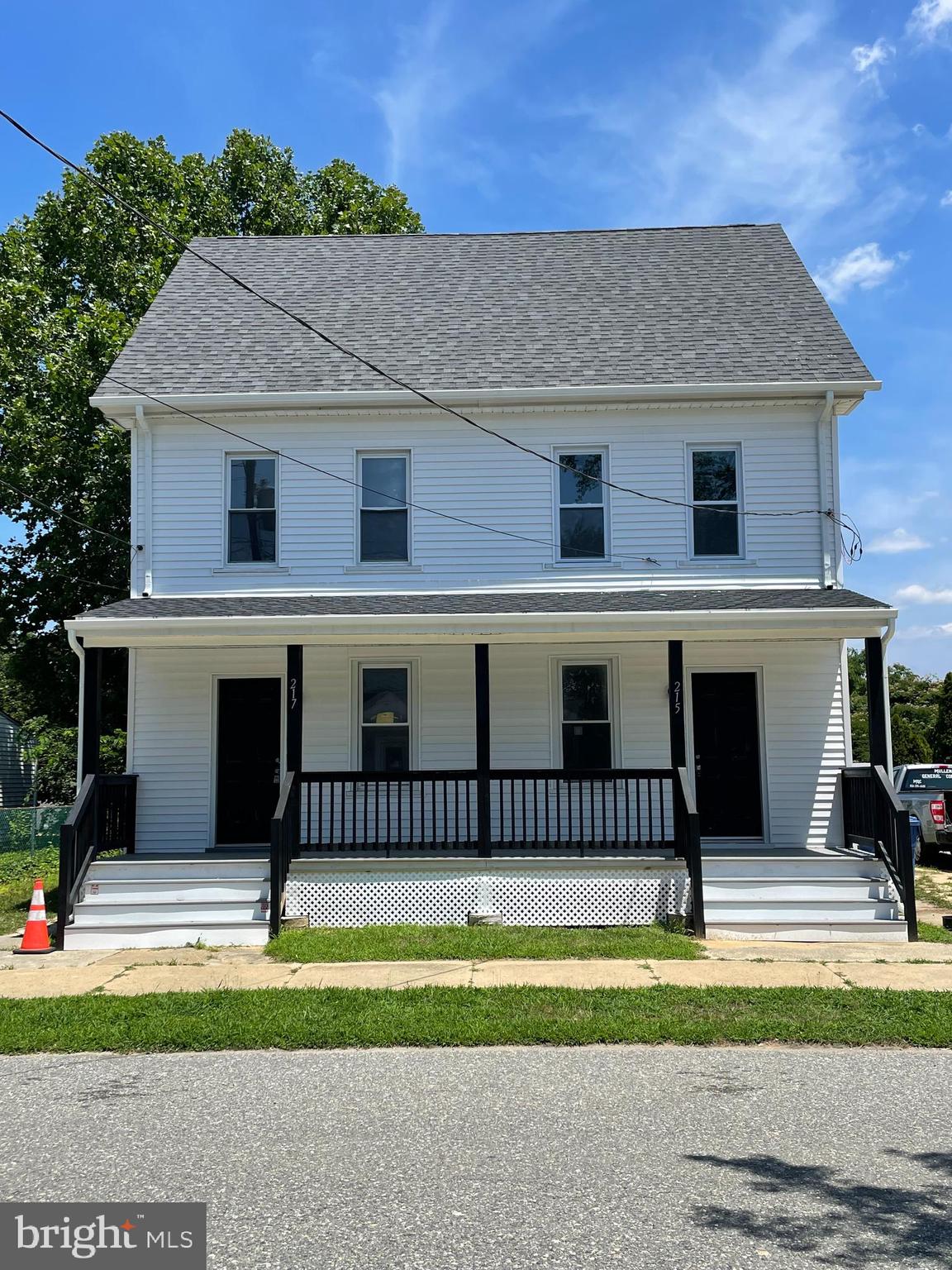 217 Broad Street Swedesboro, NJ 08085 - Photo 1 of 14 a house that has a lot of windows in it