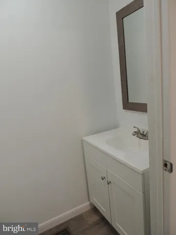 a bathroom with a sink and vanity