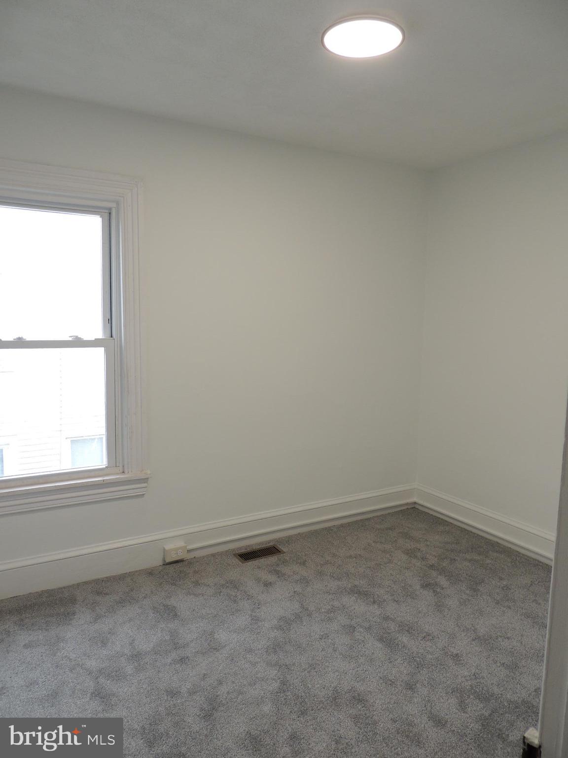 217 Broad Street Swedesboro, NJ 08085 - Photo 9 of 14 an empty room with a window
