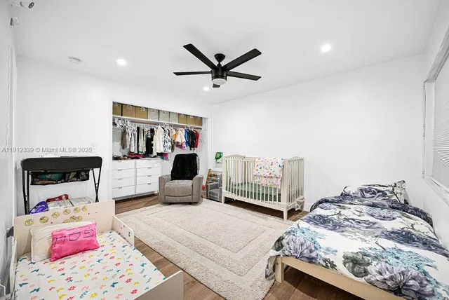 a bedroom with furniture and a wooden floor