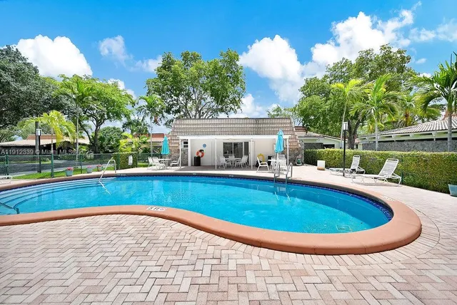 a view of outdoor space yard swimming pool and outdoor seating