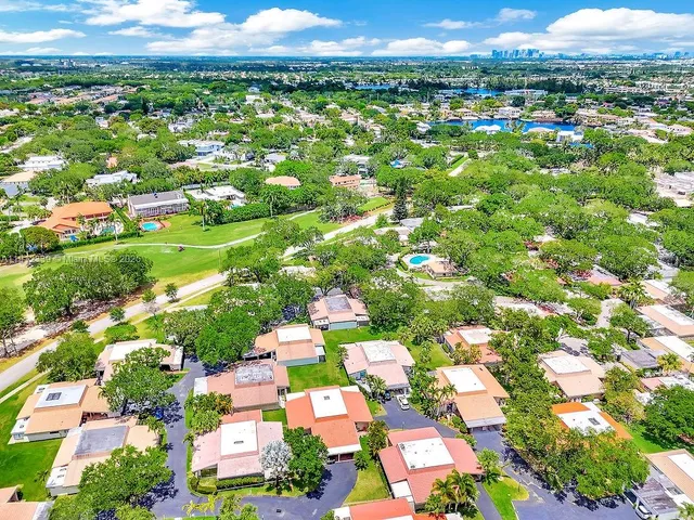 a view of a park with potted plants