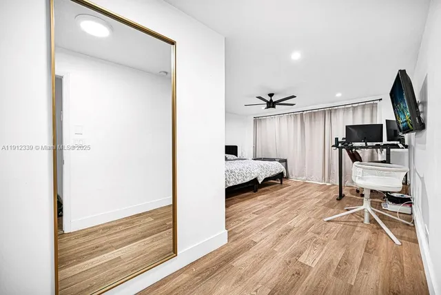 a view of a living room and a wooden floor