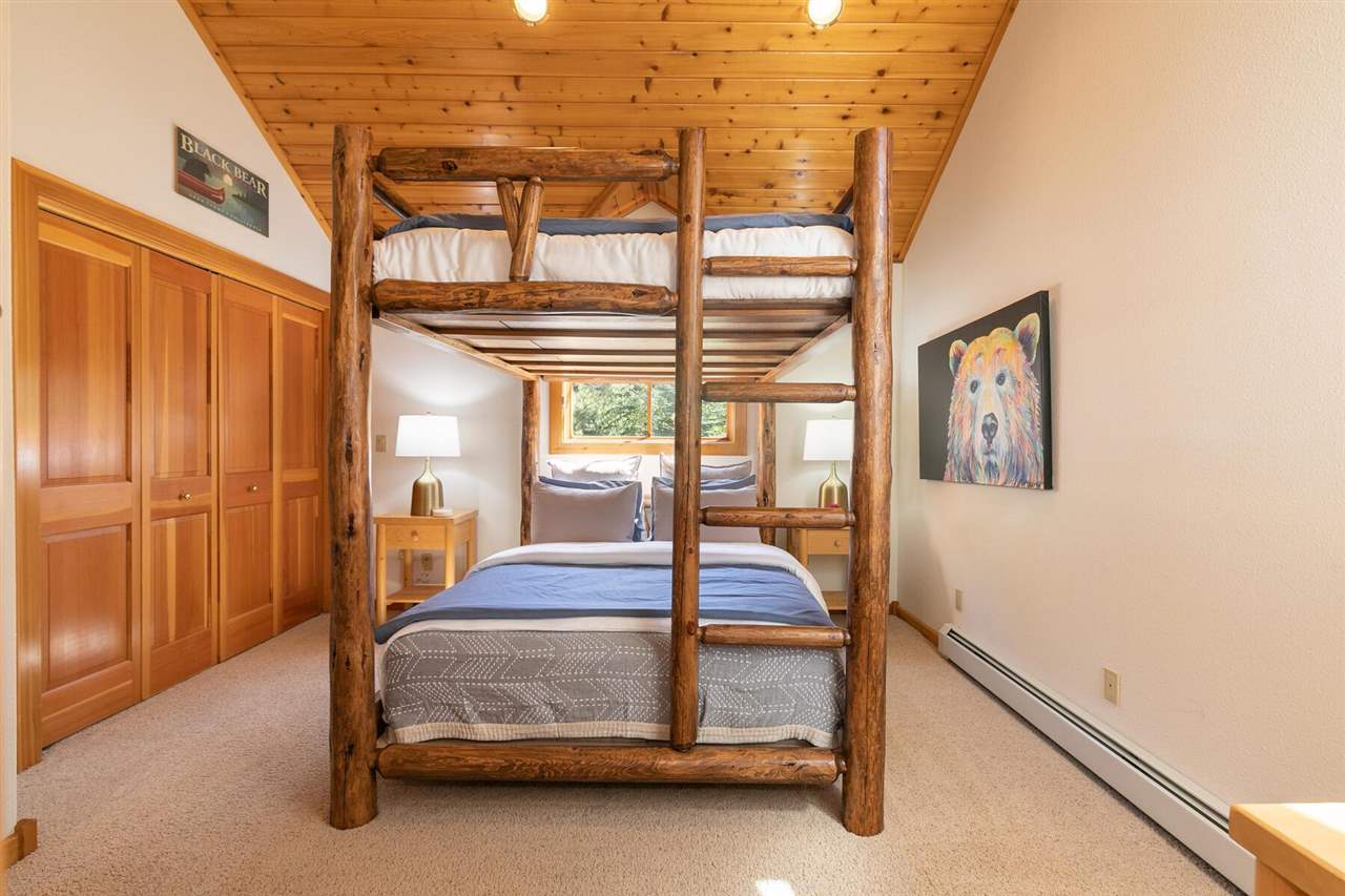 1722 Grouse Ridge Road Truckee, CA 96161 - Photo 12 of 21 a bedroom with a bed and large window