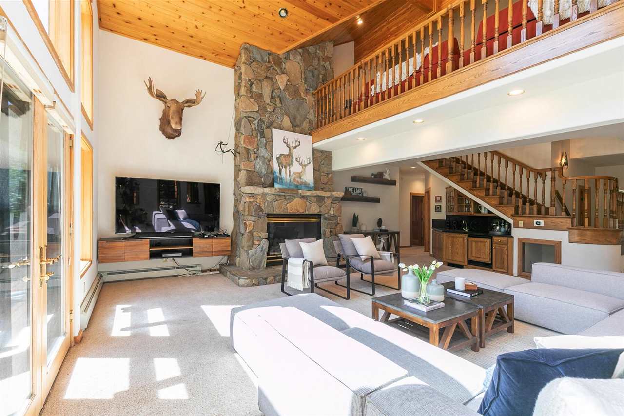 1722 Grouse Ridge Road Truckee, CA 96161 - Photo 3 of 21 a living room with furniture and a fireplace