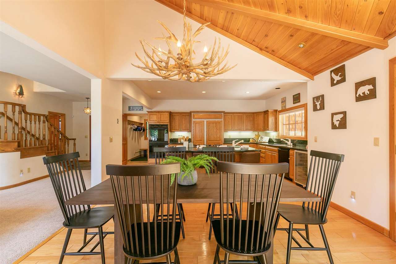 1722 Grouse Ridge Road Truckee, CA 96161 - Photo 5 of 21 a view of a dining room with furniture window and wooden floor
