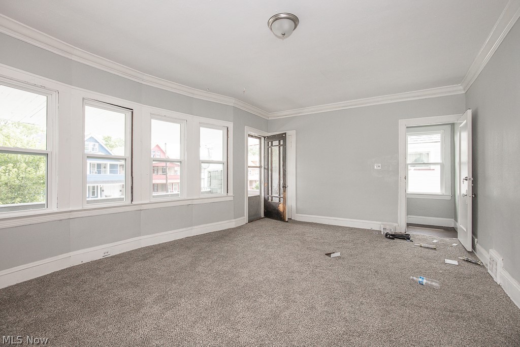 1000 Eddy Road Cleveland, OH 44108 - Photo 22 of 38 Carpeted empty room with baseboards and crown molding