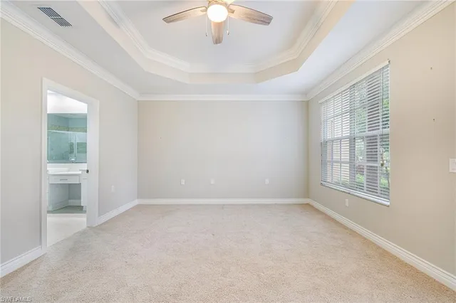 a view of an empty room and closet area