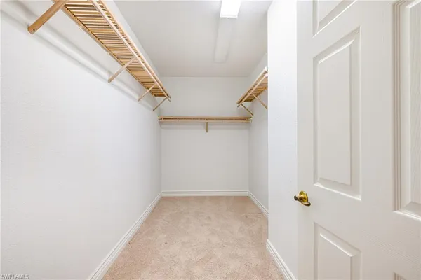 a spacious bathroom with a granite countertop sink toilet and shower