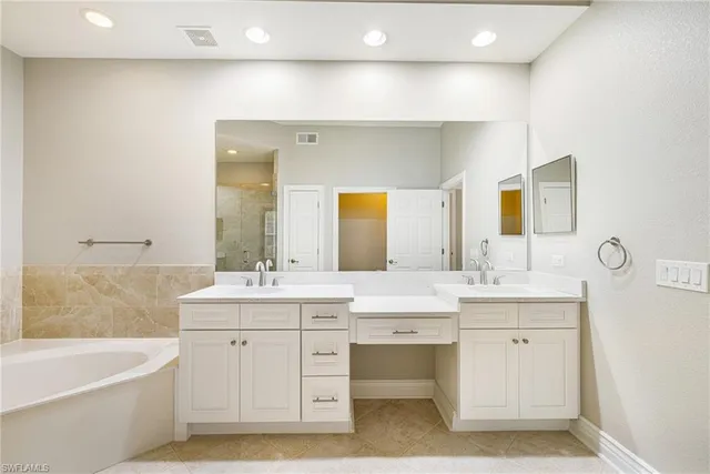 a bedroom with a bed and a night stand