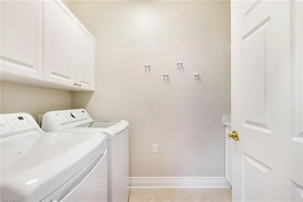 a view of a porch with a floor to ceiling window and garden