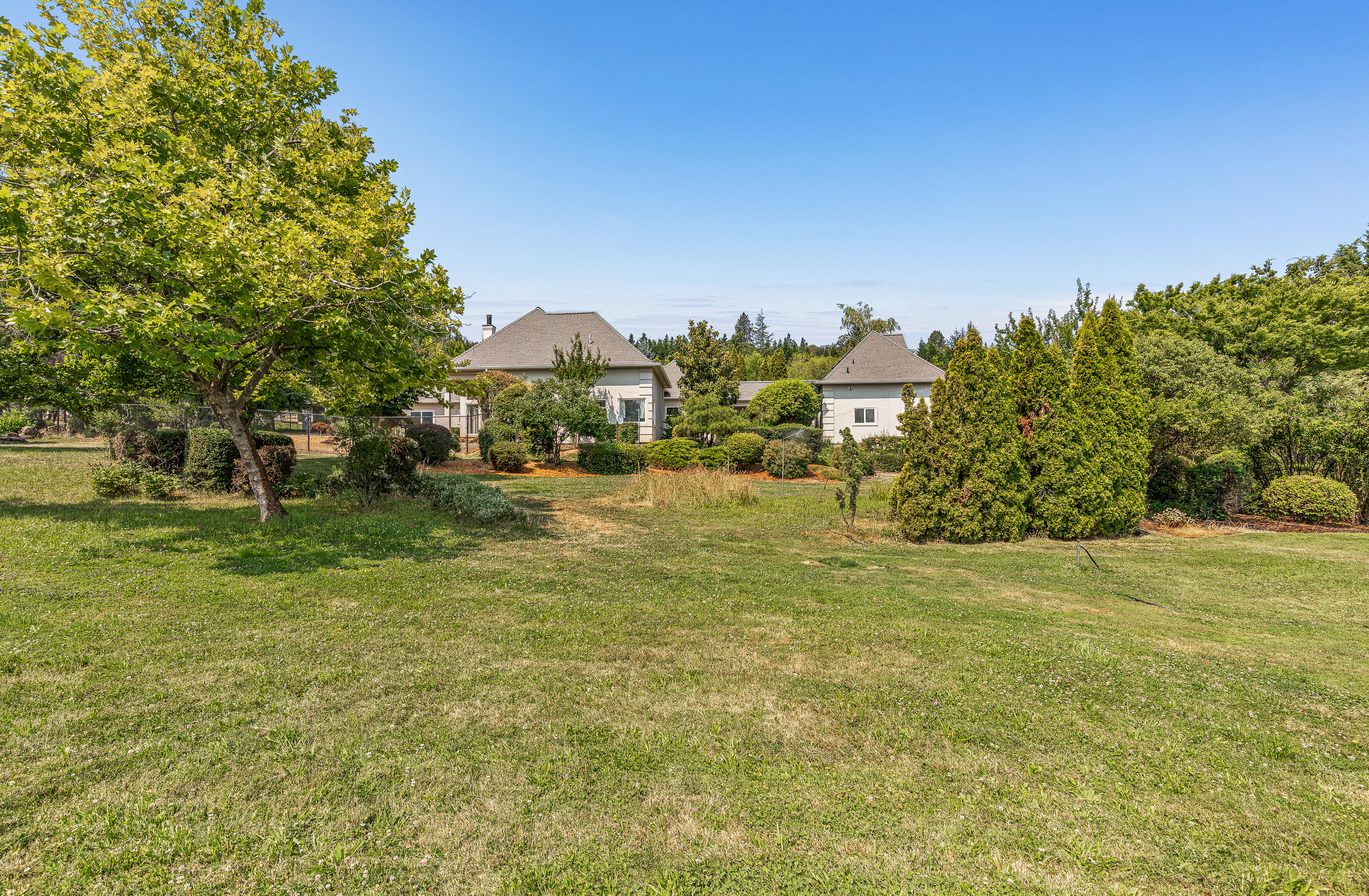 925 Anderson Creek Road Talent, OR 97540 - Photo 43 of 52 a view of a yard with a house