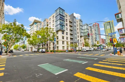 a city street lined with buildings and cars