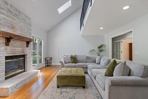 a kitchen with stainless steel appliances granite countertop a stove a sink dishwasher and a refrigerator