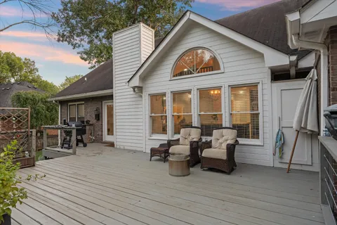 a swimming pool with lots of tress in front of it