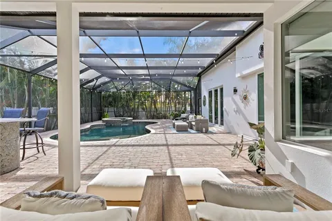 a building outdoor space with patio furniture and potted plants