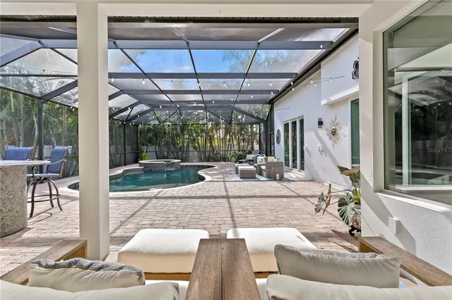 a building outdoor space with patio furniture and potted plants
