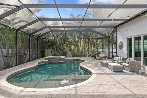 a view of a swimming pool with a patio