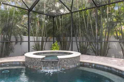 a kitchen with a stove a sink and a microwave