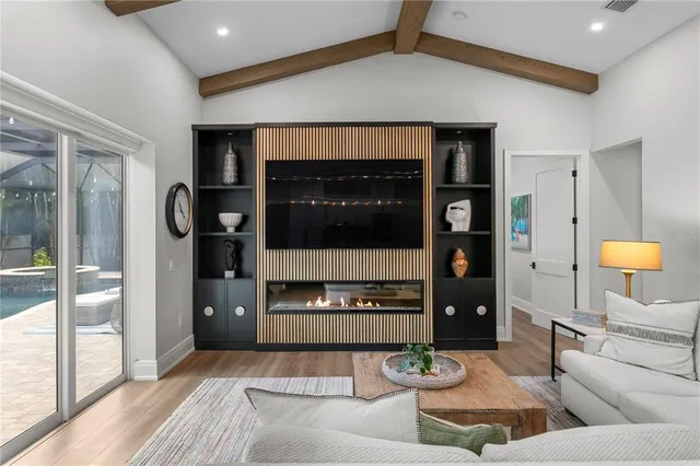 a living room with furniture and a rug