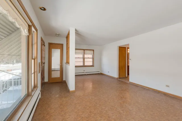 a view of a room with large windows