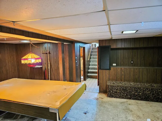 a view of a house with wooden fence