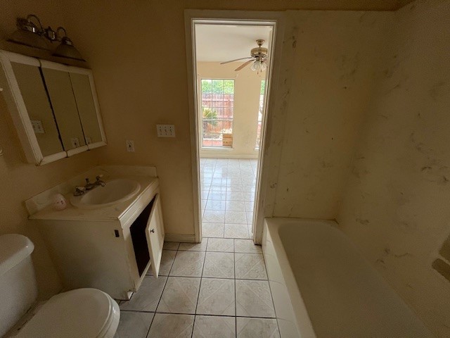 11209 Verano Street Houston, TX 77029 - Photo 11 of 12 a bathroom with a sink toilet and shower