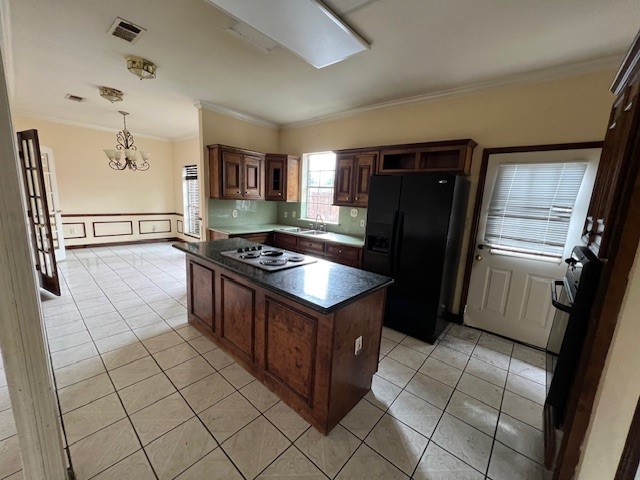 11209 Verano Street Houston, TX 77029 - Photo 8 of 12 a kitchen with stainless steel appliances granite countertop a refrigerator and a stove