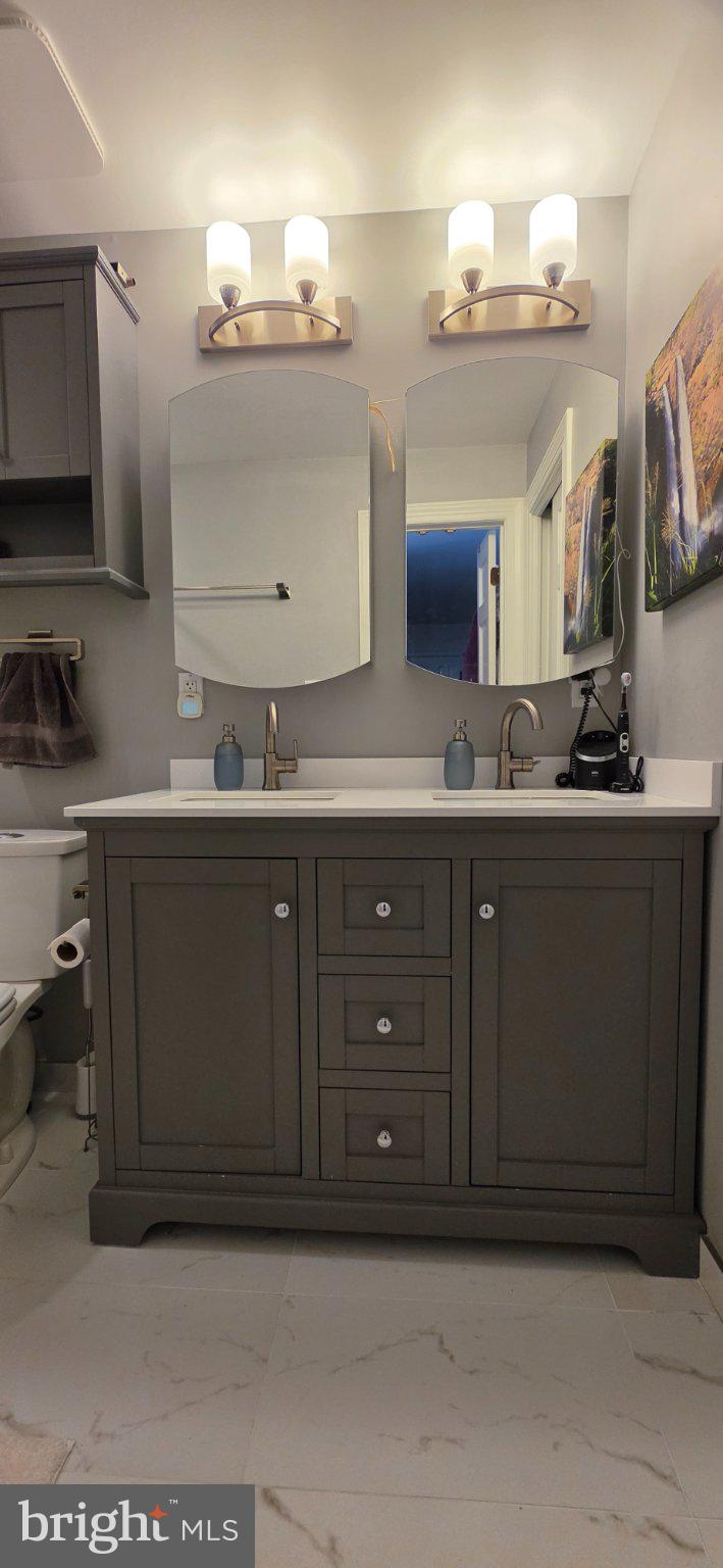 547 5th Street Southeast Washington, DC 20003 - Photo 8 of 8 Sleek modern bathroom with elegant fixtures.