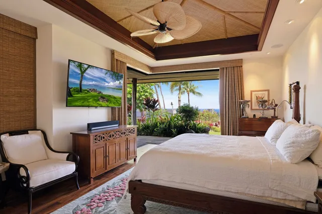 a bed room with a bed and a chair