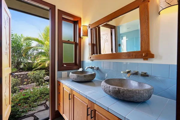 a kitchen with a sink and a large window