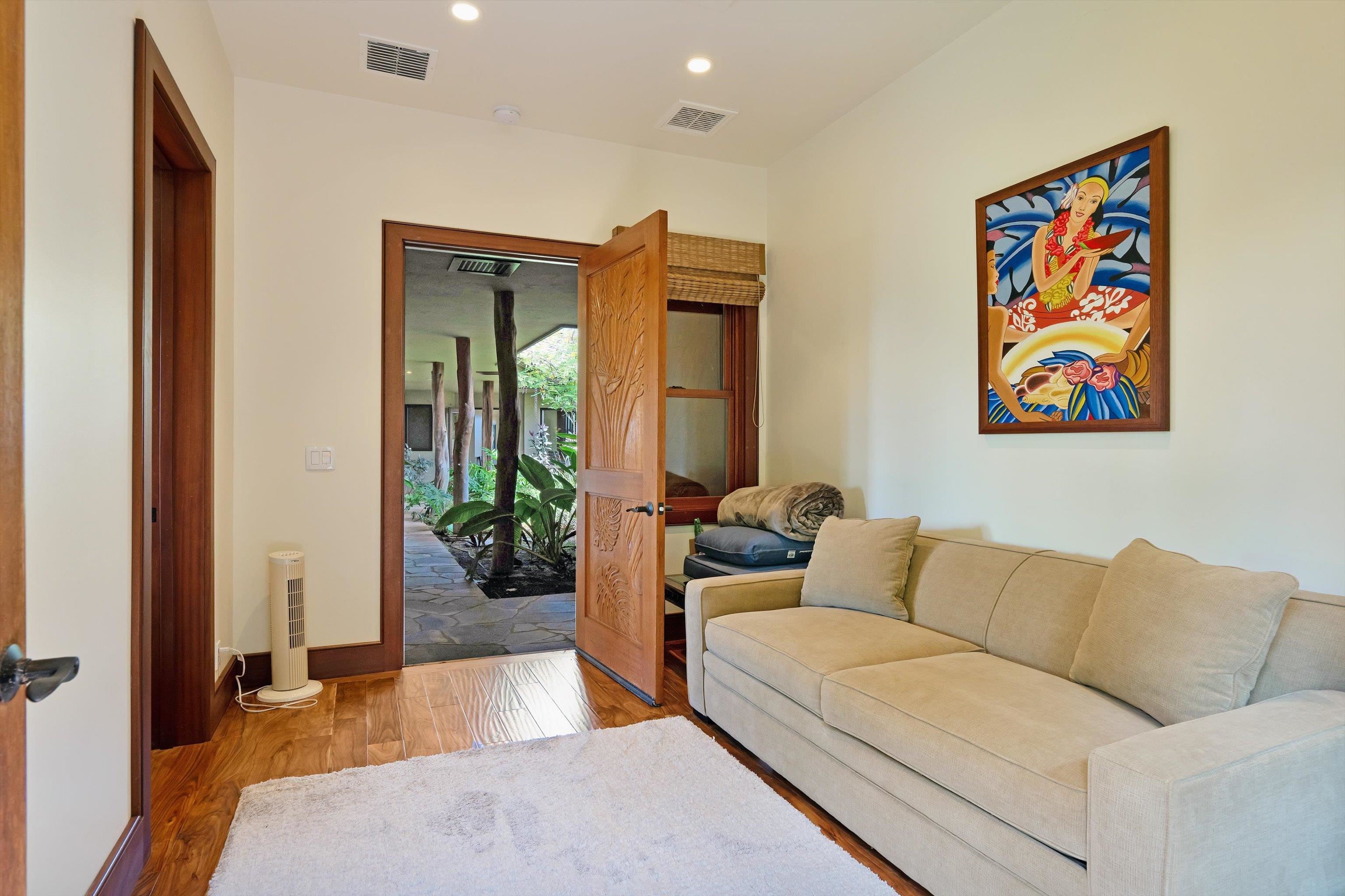 137 Anapuni Loop Lahaina, HI 96761 - Photo 17 of 19 a living room with furniture and a flat screen tv