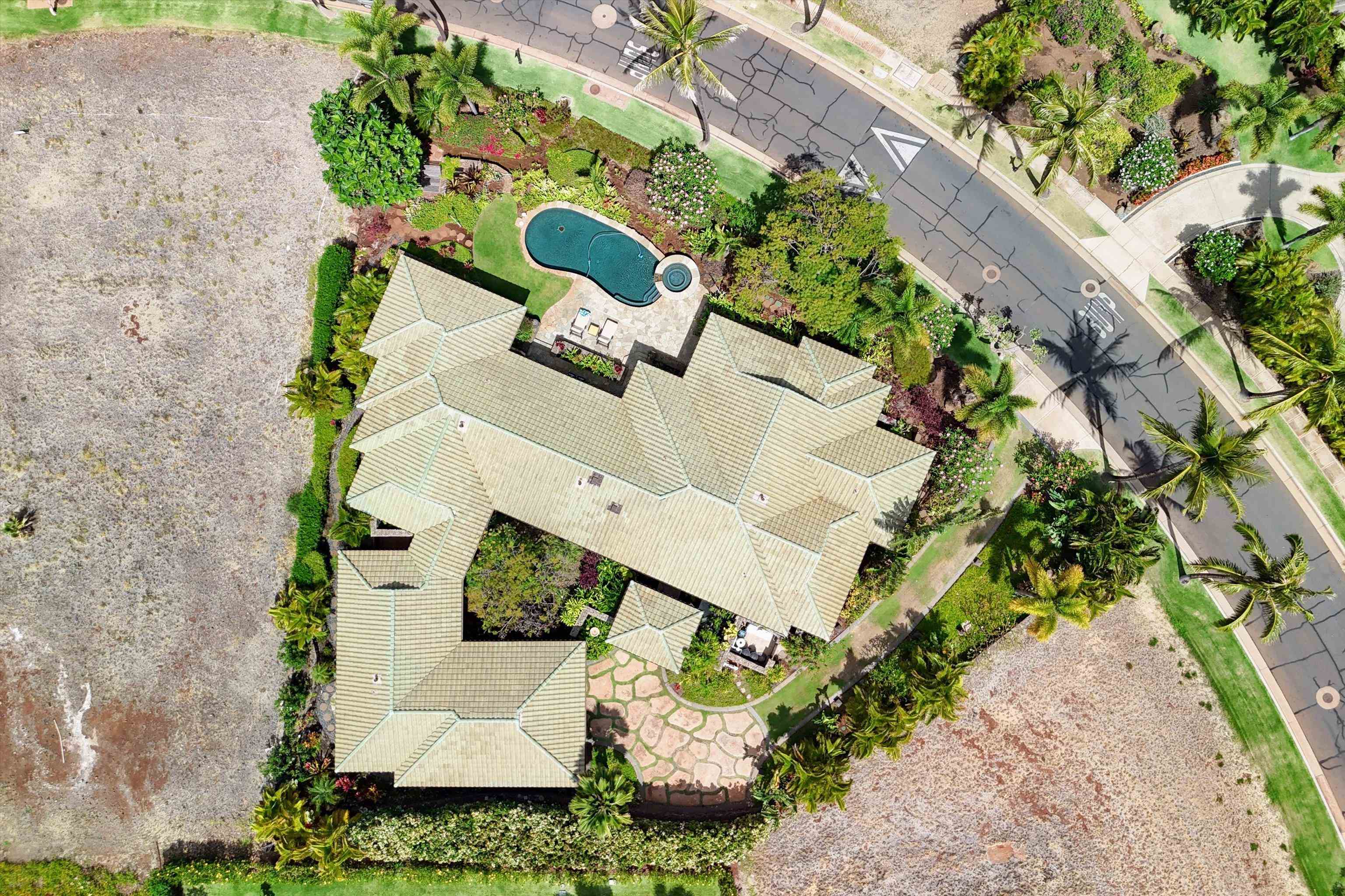 137 Anapuni Loop Lahaina, HI 96761 - Photo 2 of 19 an aerial view of a house with a yard and garden