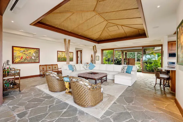 a living room with furniture a window and a table