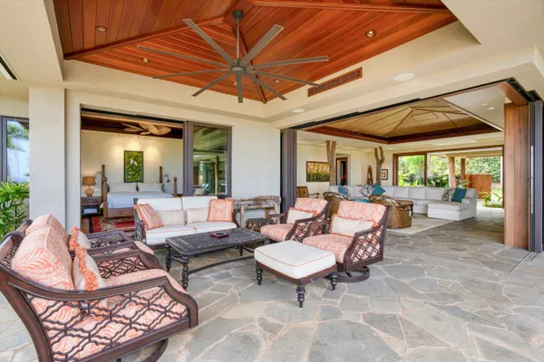 a outdoor space with patio the couches and a dining table with the view of kitchen