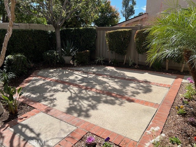 704 Arroues Drive Fullerton, CA 92835 - Photo 3 of 13 a view of backyard with potted plants and a large tree