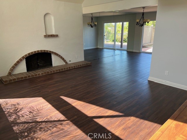 704 Arroues Drive Fullerton, CA 92835 - Photo 4 of 13 a view of empty room with wooden floor and fan