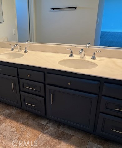 704 Arroues Drive Fullerton, CA 92835 - Photo 6 of 13 a bathroom with a sink and a mirror