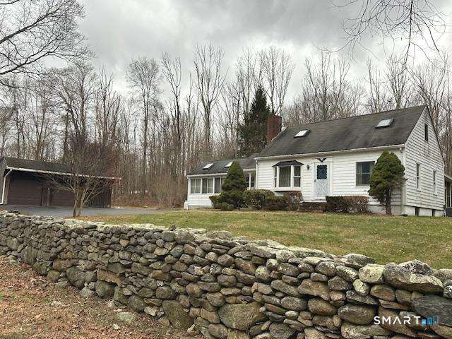 609 Water Street Canterbury, CT 06331 - Photo 2 of 27 a front view of a house with a yard