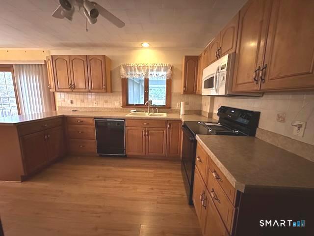 609 Water Street Canterbury, CT 06331 - Photo 7 of 27 a kitchen with stainless steel appliances granite countertop a sink a stove and a refrigerator