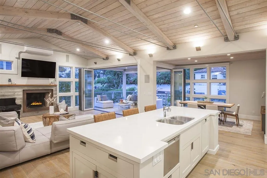 153 5th Street Encinitas, CA 92024 - Photo 11 of 25 a large white kitchen with a large window