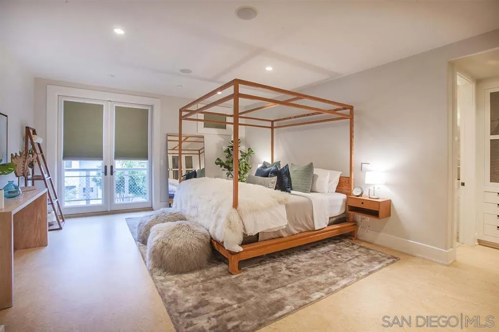153 5th Street Encinitas, CA 92024 - Photo 18 of 25 a bed sitting in a bedroom next to a window