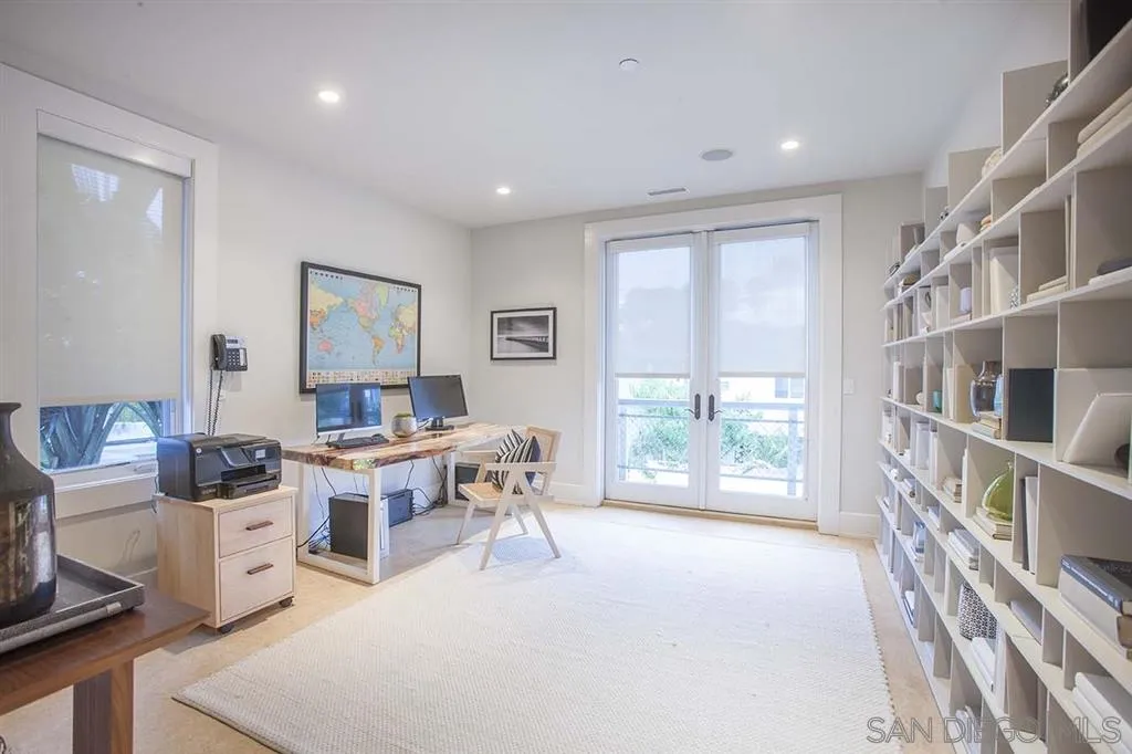 153 5th Street Encinitas, CA 92024 - Photo 22 of 25 a living room with furniture a window and a table
