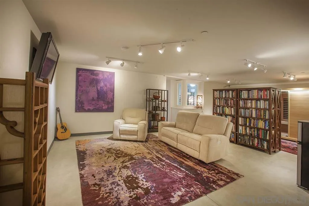 153 5th Street Encinitas, CA 92024 - Photo 24 of 25 a living room with furniture or wooden floor and a chandelier