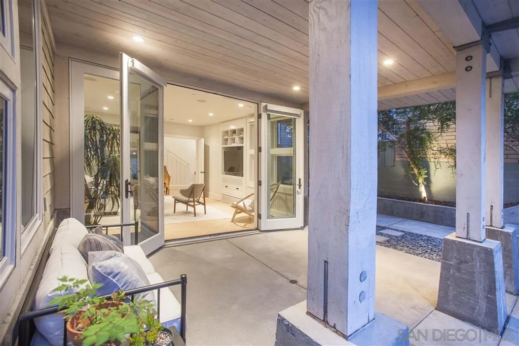 153 5th Street Encinitas, CA 92024 - Photo 3 of 25 a living room with furniture and a floor to ceiling window
