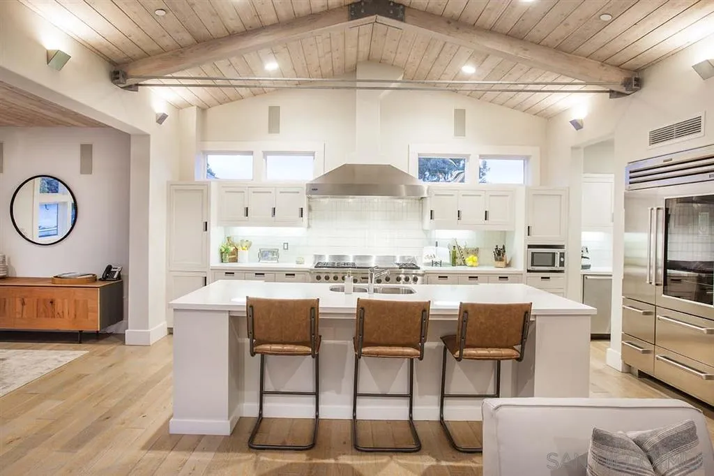 153 5th Street Encinitas, CA 92024 - Photo 10 of 25 a kitchen with a table chairs stove and cabinets